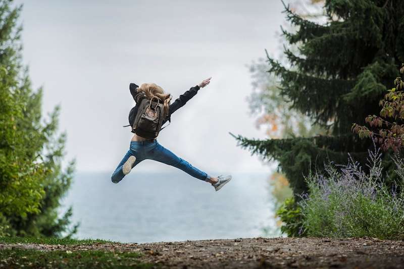 woman jumping and enjoying life